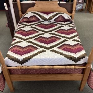 This beautiful Bargello quilt features hearts in maroon, magenta, raspberry, pink, and black fabrics with metallic gold accents on a white background.