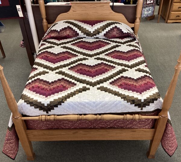 This beautiful Bargello quilt features hearts in maroon, magenta, raspberry, pink, and black fabrics with metallic gold accents on a white background.